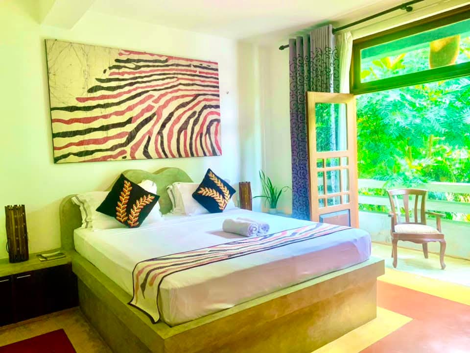 Gangula Villa guest room interior with warm lighting